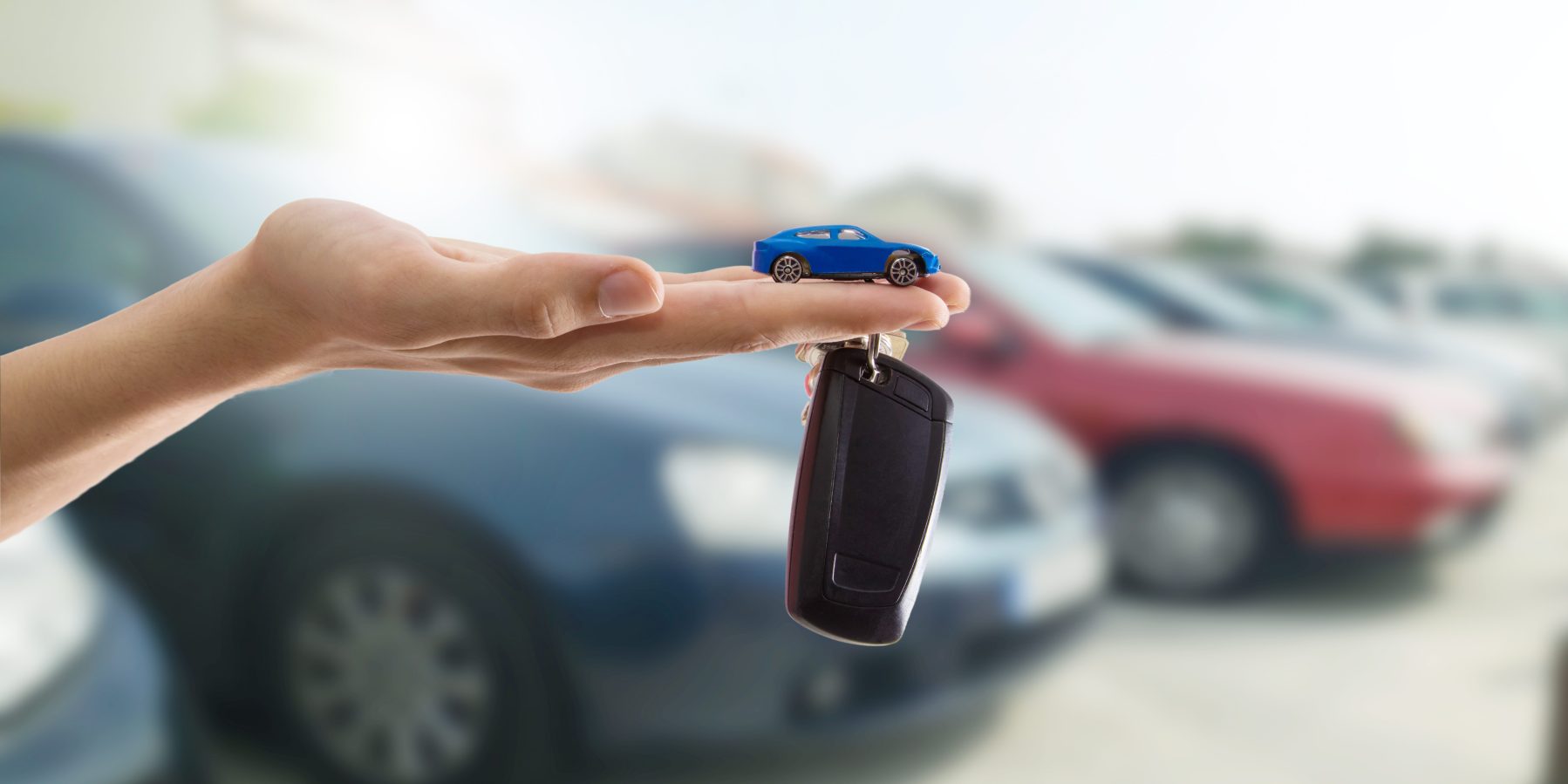 hands with keys or car control
